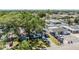 An aerial view of the property showing the front yard, covered parking, and neighborhood at 2808 W Lake Ave, Tampa, FL 33607