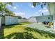 Spacious backyard with lawn and storage sheds at 2808 W Lake Ave, Tampa, FL 33607