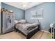 Cozy bedroom featuring a ceiling fan, window, and unique decor at 2808 W Lake Ave, Tampa, FL 33607