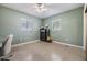 Bright bedroom with natural light from two windows and ceiling fan at 2808 W Lake Ave, Tampa, FL 33607