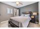 Charming bedroom with a ceiling fan, large window and a comfortable queen bed at 2808 W Lake Ave, Tampa, FL 33607