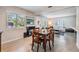 Dining area featuring a wooden table, four chairs and natural lighting at 2808 W Lake Ave, Tampa, FL 33607