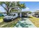 Beautiful single-story home boasts a covered carport and a well-manicured lawn at 2808 W Lake Ave, Tampa, FL 33607