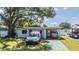 Charming single-story home featuring well-maintained landscaping and a spacious driveway at 2808 W Lake Ave, Tampa, FL 33607