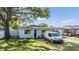 Exterior shot of a charming single-story home with a covered parking space at 2808 W Lake Ave, Tampa, FL 33607