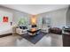 Bright living room featuring a plush sectional sofa, stylish rug, and ample natural light at 2808 W Lake Ave, Tampa, FL 33607