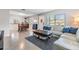 Open-concept living area with stylish decor, comfortable seating, and dining table at 2808 W Lake Ave, Tampa, FL 33607