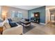 Comfortable living room with modern furnishings and a flat-screen television at 2808 W Lake Ave, Tampa, FL 33607