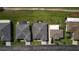 Straight down aerial shot of homes with pristine lawns bordering a lush green golf course at 29408 Princeville Dr, San Antonio, FL 33576