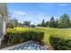 Back patio offers a view of the community golf course and clubhouse, with golf carts in the background at 29408 Princeville Dr, San Antonio, FL 33576