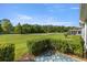 Private back patio overlooking the lush green golf course with a serene, natural view at 29408 Princeville Dr, San Antonio, FL 33576