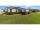 Lush backyard features a well-maintained lawn and manicured hedges, offering a private outdoor space at 29408 Princeville Dr, San Antonio, FL 33576