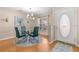 Cozy dining area with a glass-top table, stylish chairs, and elegant lighting at 29408 Princeville Dr, San Antonio, FL 33576