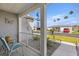 Inviting front porch with chairs and decor, showcasing a relaxed outdoor space at 29408 Princeville Dr, San Antonio, FL 33576