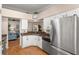 Well-designed kitchen with granite countertops, stainless steel appliances, and open to the living area at 29408 Princeville Dr, San Antonio, FL 33576