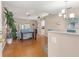 Bright living room with hardwood floors, comfortable seating, and an open layout at 29408 Princeville Dr, San Antonio, FL 33576