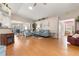Spacious living room with hardwood floors, vaulted ceilings, and modern decor for comfortable living at 29408 Princeville Dr, San Antonio, FL 33576