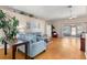 Spacious living room with hardwood floors, comfortable seating, and lots of natural light at 29408 Princeville Dr, San Antonio, FL 33576