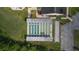 Aerial view of community shuffleboard courts with shaded seating and well-kept grounds at 29408 Princeville Dr, San Antonio, FL 33576