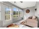 Sunroom with white tile floors and white walls, and view to the outside at 29408 Princeville Dr, San Antonio, FL 33576