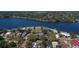 Wide aerial shot displaying the neighborhood's proximity to a large scenic body of water and nearby coastline at 307 Bay St, Tarpon Springs, FL 34689