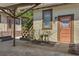 Back entrance with private stairs and outdoor lighting, offering convenient access to the property at 307 Bay St, Tarpon Springs, FL 34689