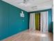 Bedroom with wood flooring and access to a closet, a window AC unit, and fresh paint at 307 Bay St, Tarpon Springs, FL 34689