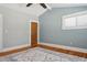 Cozy bedroom featuring wood floors, a neutral color palette, and natural light at 307 Bay St, Tarpon Springs, FL 34689