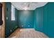 Empty bedroom featuring wood flooring, a window with blinds, fresh paint, and ceiling fan at 307 Bay St, Tarpon Springs, FL 34689