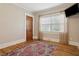 Light and bright bedroom features hardwood floors and a large window at 307 Bay St, Tarpon Springs, FL 34689