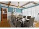 Formal dining room with wooden table, coffered ceiling, and natural light at 307 Bay St, Tarpon Springs, FL 34689