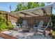 Cozy outdoor space features a fire pit surrounded by Adirondack chairs and a privacy fence at 307 Bay St, Tarpon Springs, FL 34689
