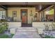 Inviting front porch with cozy seating and decorative details at 307 Bay St, Tarpon Springs, FL 34689