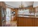 Traditional kitchen with custom wood cabinets, stainless appliances, and granite countertops at 307 Bay St, Tarpon Springs, FL 34689