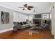 Bright living room featuring a fireplace, hardwood floors, and modern furnishings at 307 Bay St, Tarpon Springs, FL 34689