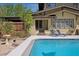 Backyard pool with lounge chairs and lush garden plants at 307 Bay St, Tarpon Springs, FL 34689