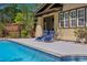 Swimming pool with two lounge chairs on a sunny day at 307 Bay St, Tarpon Springs, FL 34689
