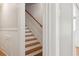 A classic wooden staircase is paired with white trim for a clean, traditional look at 307 Bay St, Tarpon Springs, FL 34689