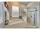 Well lit bathroom with glass shower and soaking tub at 308 Manns Harbor Dr, Apollo Beach, FL 33572