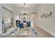 Elegant dining area featuring a modern glass table and decor, creating a perfect entertaining space at 308 Manns Harbor Dr, Apollo Beach, FL 33572