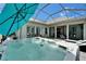 Inviting hot tub on the screened patio, offering a luxurious and relaxing outdoor experience at 308 Manns Harbor Dr, Apollo Beach, FL 33572