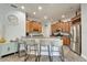 Charming kitchen features a breakfast bar with seating, light wood cabinets, stainless steel appliances, and an adjacent eating area at 308 Manns Harbor Dr, Apollo Beach, FL 33572