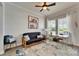 Bright living room with large windows, stylish furniture, and a cozy atmosphere at 308 Manns Harbor Dr, Apollo Beach, FL 33572