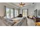 Spacious living room with lots of natural light, a ceiling fan, and comfortable furniture at 308 Manns Harbor Dr, Apollo Beach, FL 33572