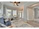 Sun-filled living area with light wood floors, soft natural light, and an open airy feel at 308 Manns Harbor Dr, Apollo Beach, FL 33572