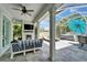 Beautiful screened-in patio area with a fireplace, television, and a hot tub for outdoor living at 308 Manns Harbor Dr, Apollo Beach, FL 33572