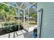 Outdoor shower area on a screened patio, perfect for rinsing off after a swim or a day at the beach at 308 Manns Harbor Dr, Apollo Beach, FL 33572