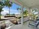 Welcoming front porch with outdoor chairs and views of the serene neighborhood at 308 Manns Harbor Dr, Apollo Beach, FL 33572