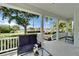 Charming front porch with comfortable seating and lush landscaping views at 308 Manns Harbor Dr, Apollo Beach, FL 33572