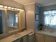Bathroom vanity with great lighting and a large mirror is perfect for getting ready in style and comfort at 3114 Briar St. St, Wesley Chapel, FL 33543
